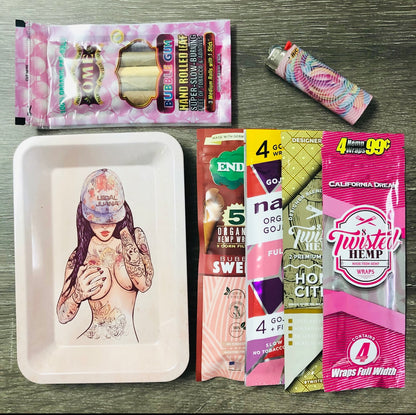 Photo of the contents laid out on a table that displays includes a rolling tray, hemp wraps, palm leaf cones, and a lighter.